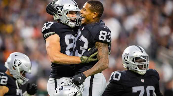 Nov 21, 2021; Paradise, Nevada, USA; Las Vegas Raiders tight end Foster Moreau (87) celebrates a second half touchdown with teammate Darren Waller (83) against the Cincinnati Bengals at Allegiant Stadium.